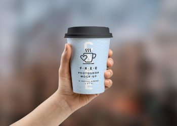 Free Medium and Small Cup In Hand Mockup PSD