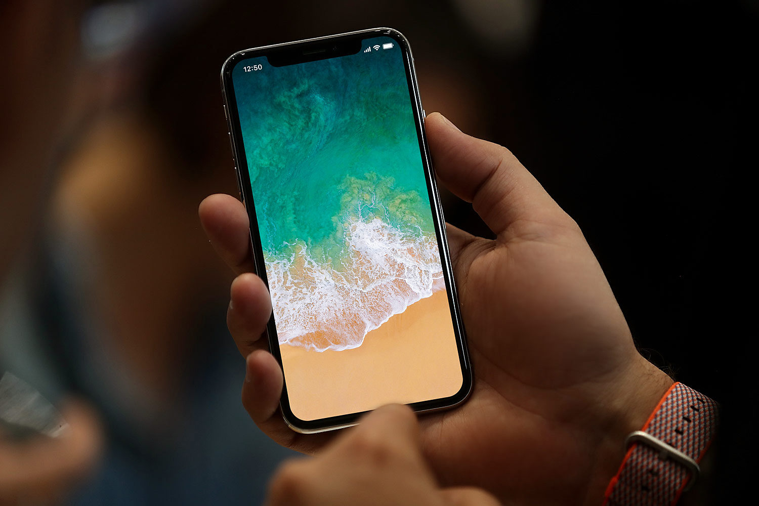 iPhone X with Status Bar in Hand Free Mockup