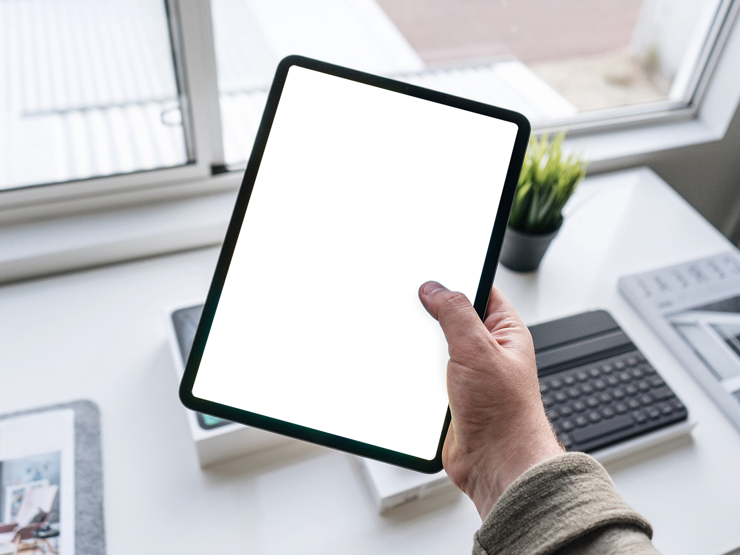Tablet in Hand Free Mockup