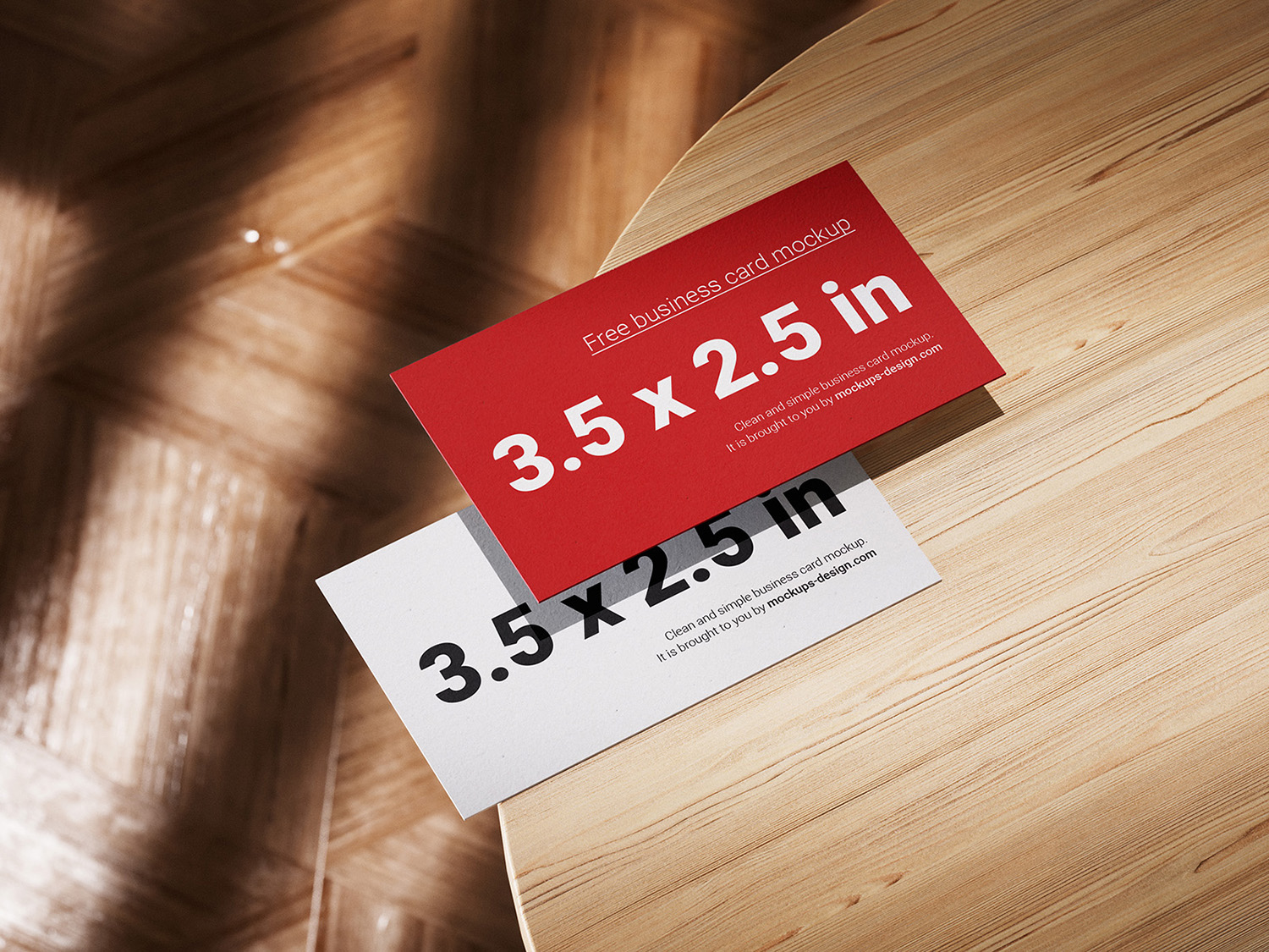 Business Cards Lying on a Wooden Table Free Mockups