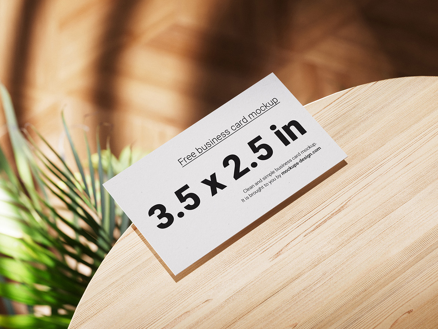Business Cards Lying on a Wooden Table Free Mockups