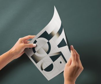 Hand Holding Glossy Paper Free Mockup